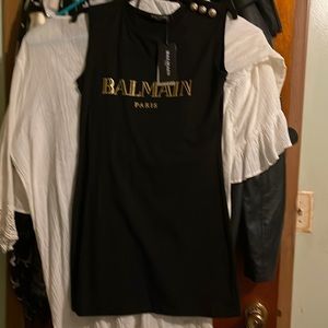 Cotton/spandex tank dress. Black with gold foil writing, 31 inches long, size S